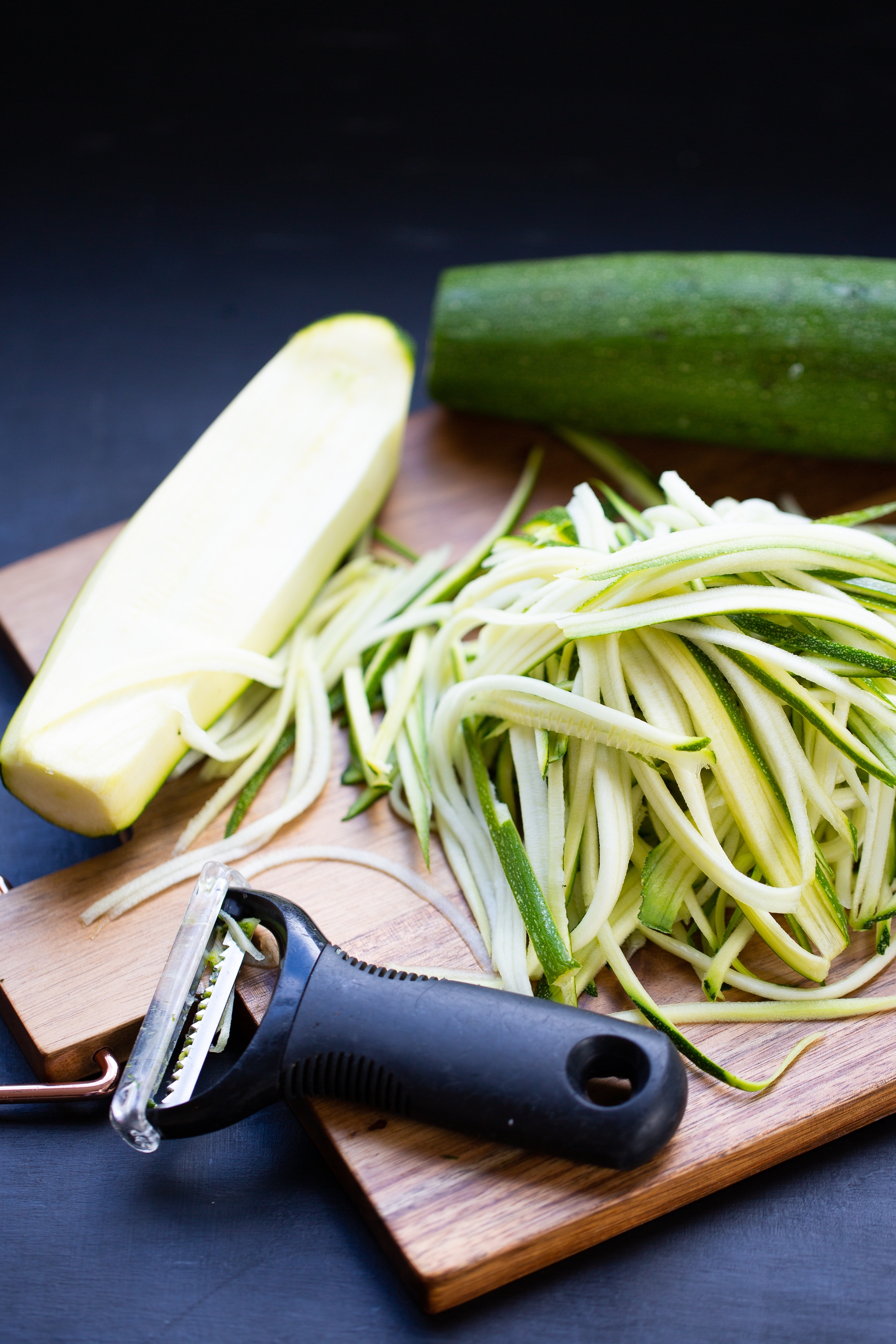 julienned zucchini on a cutting board