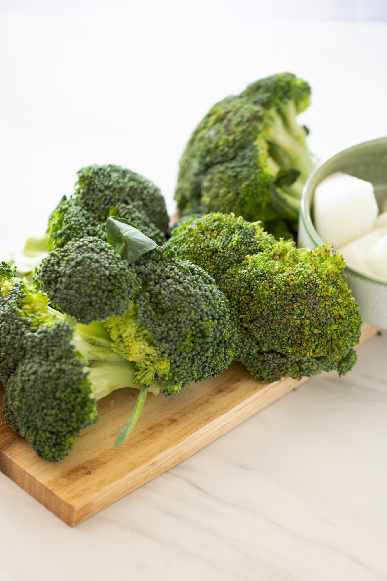 Brocoli pieces on a chopping board