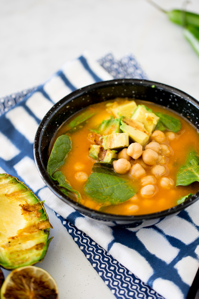 Chickpea soup with roasted avocado and charred lime