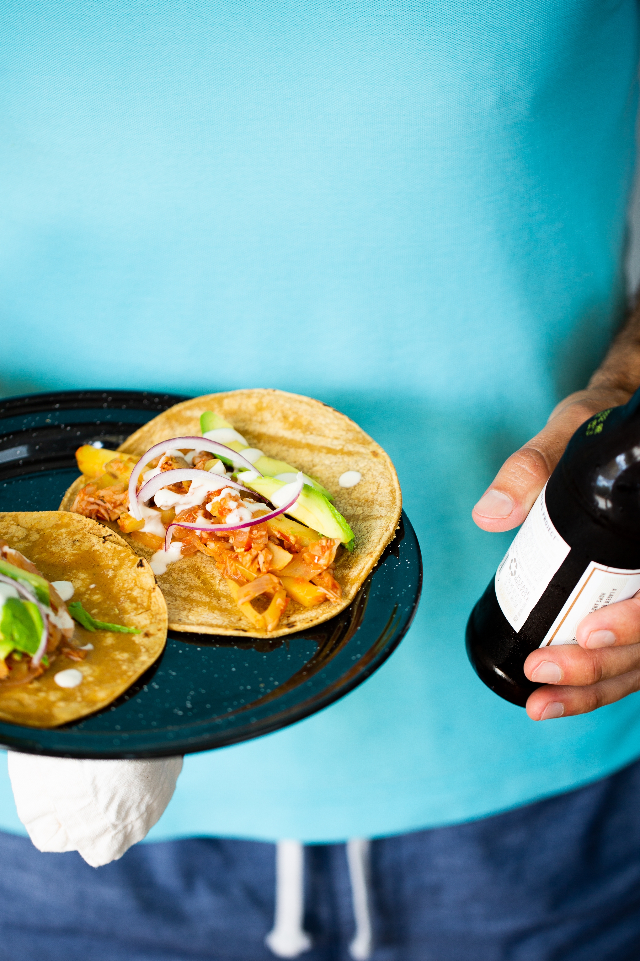 Jackfruit vegan tinga tacos on a black peltre plate 