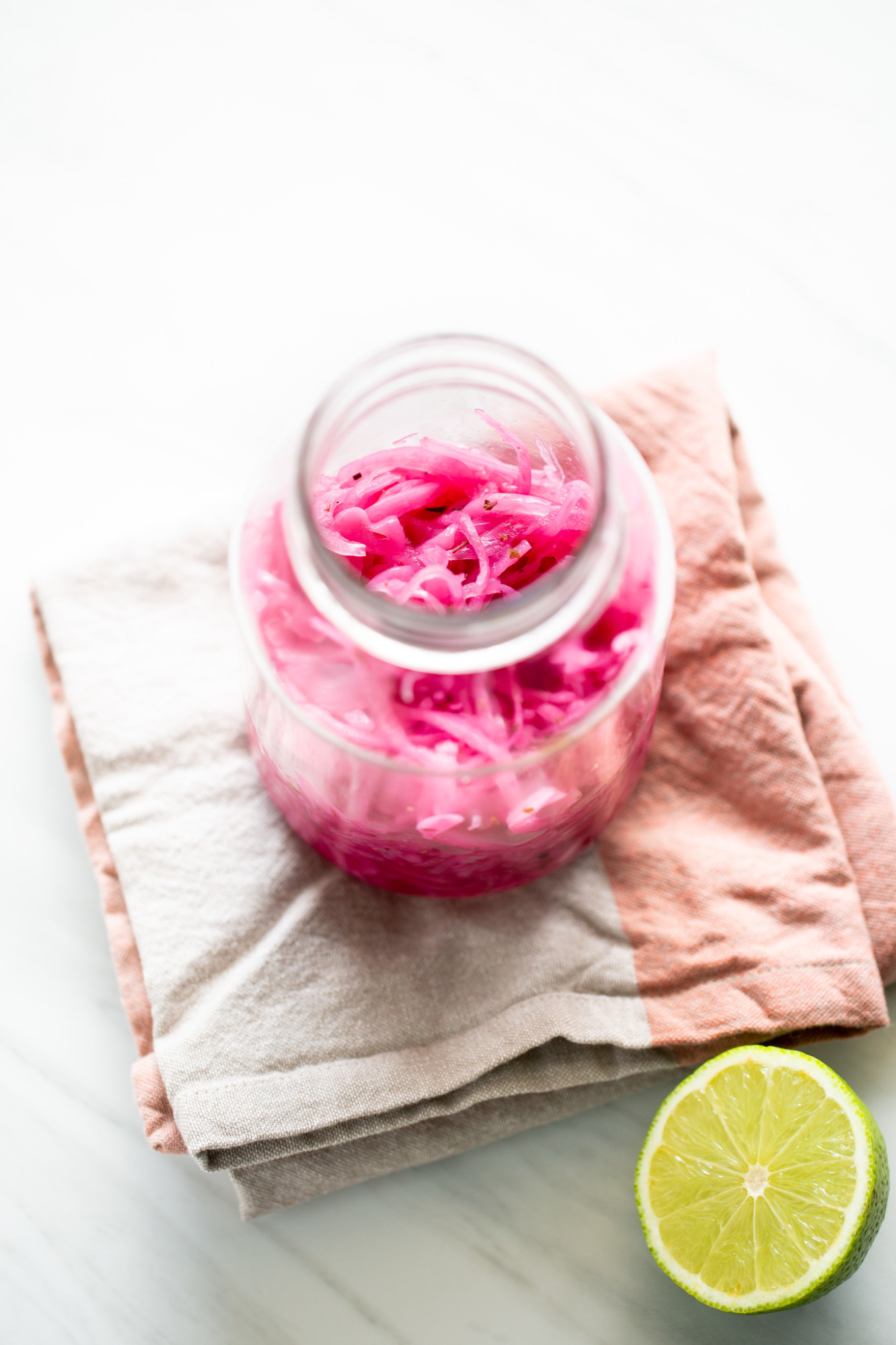 Mexican pickled onions in a jar, these are red onions