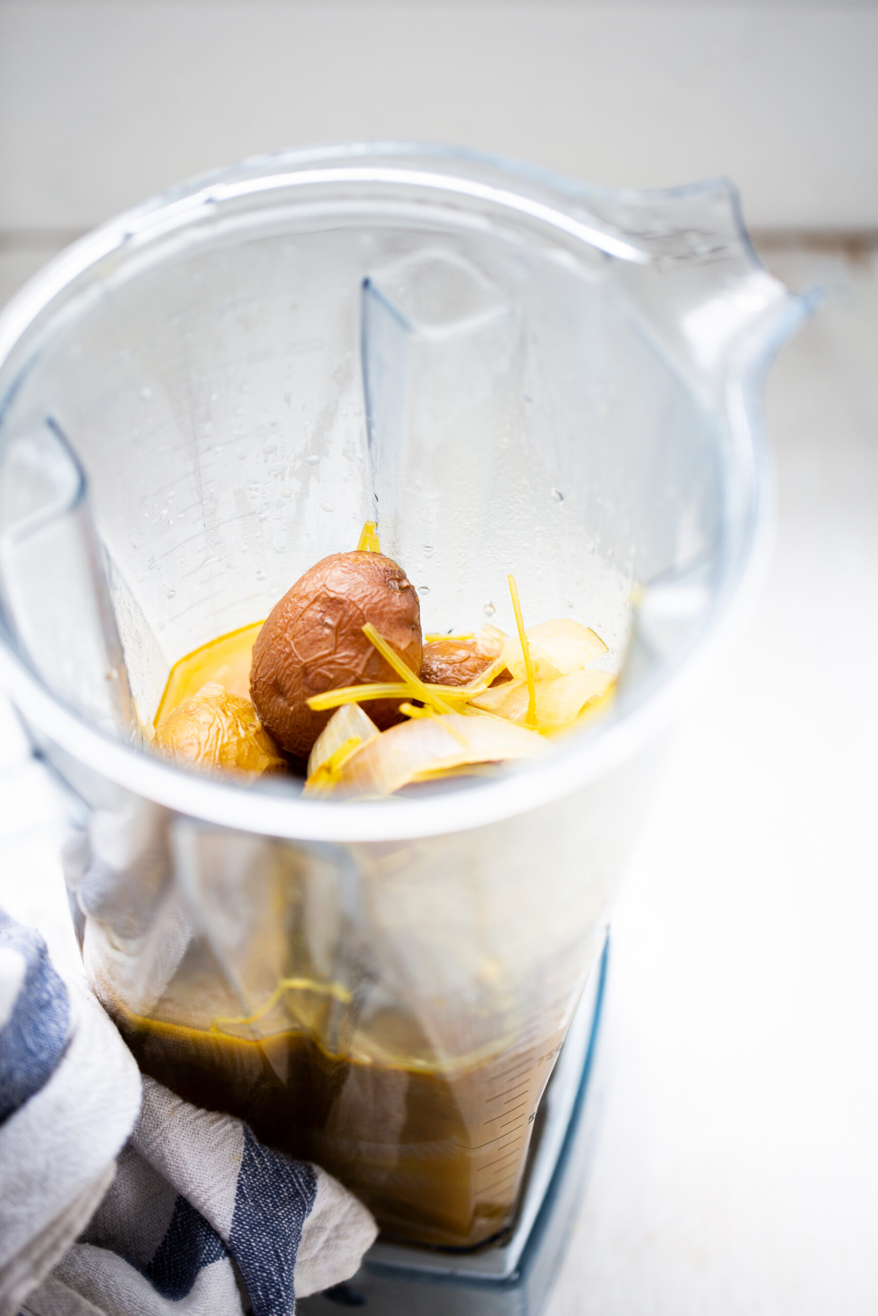 potato and cilantro in a blender