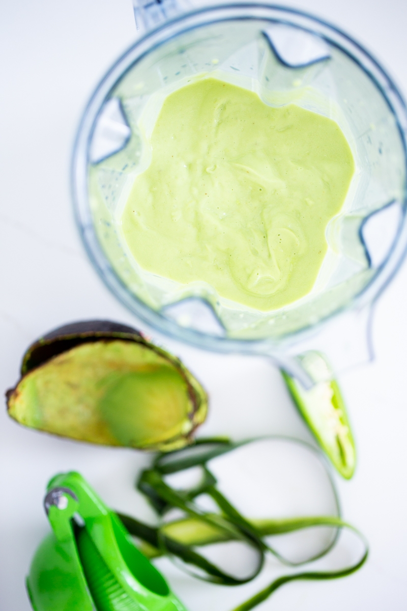 blendend avocado soup in the blender container