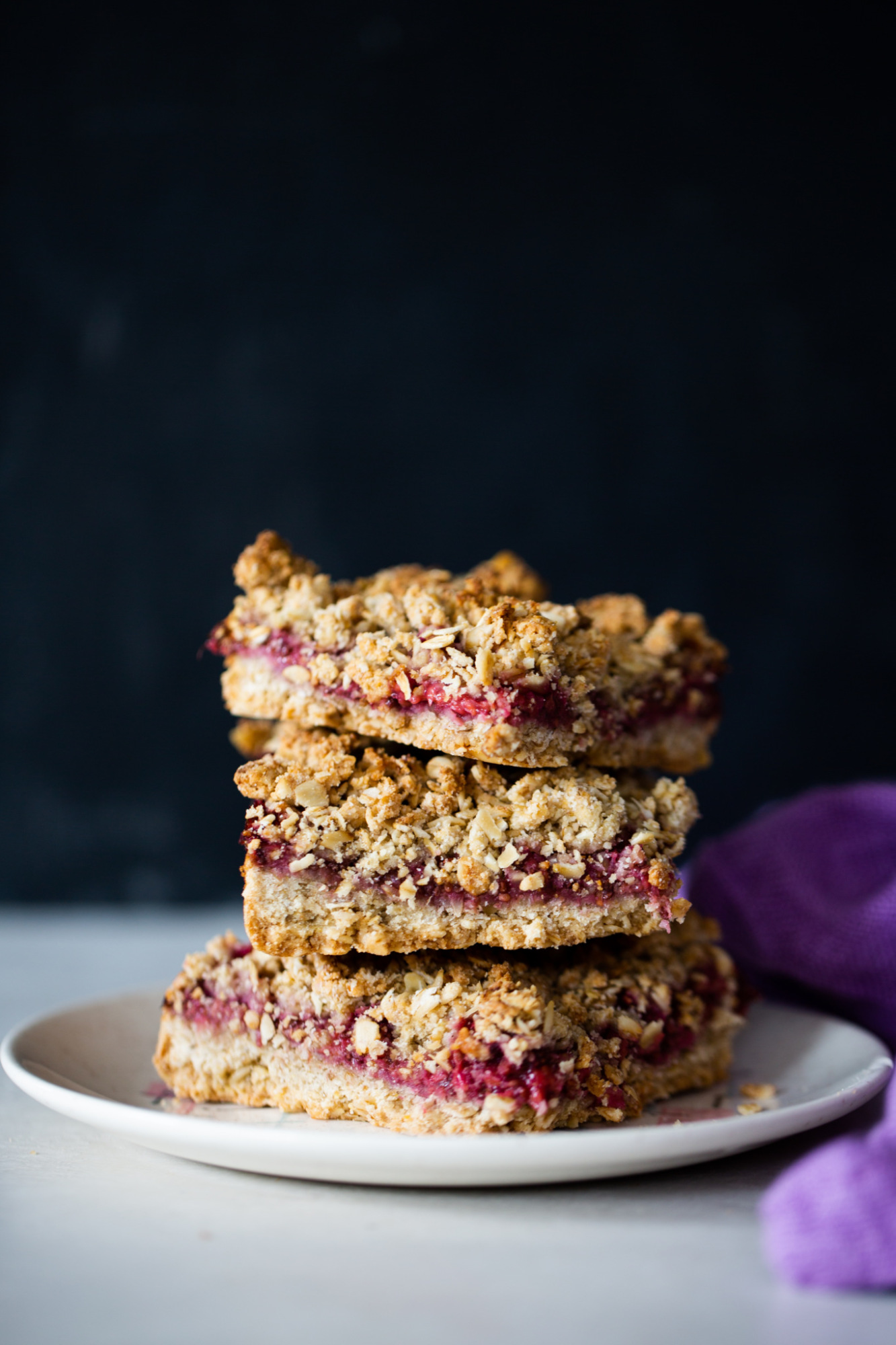 a stack of three Healthy Raspberry oatmeal bars 