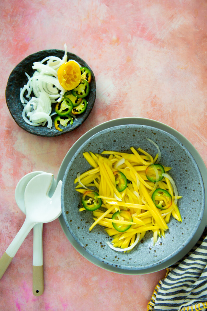 Green mango salad in a grey bowl