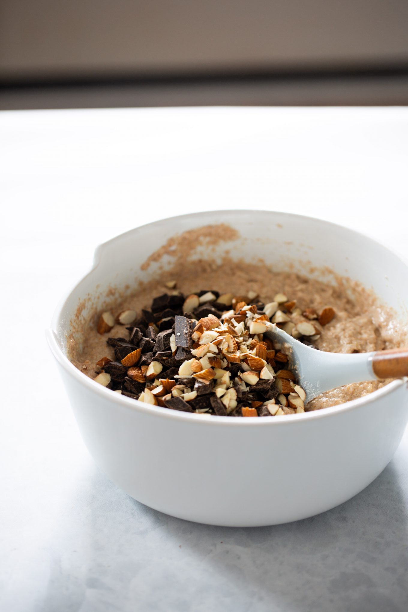 A bowl with ingredients to make vegan muffins with dark chocolate