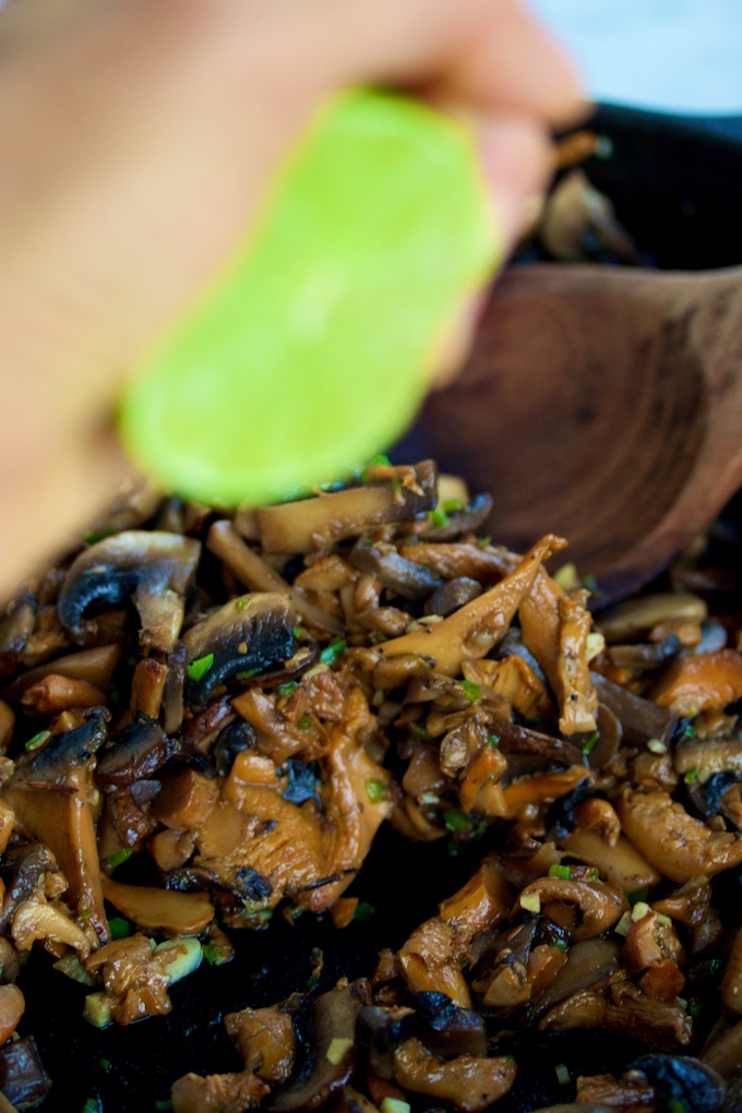 Squeezing lime juice over perfectly cooked mushrooms