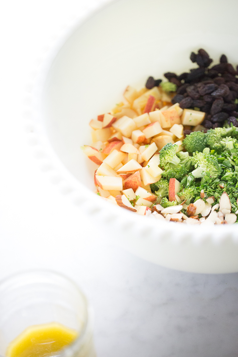 Diced apple, broccoli and raisins to make salad