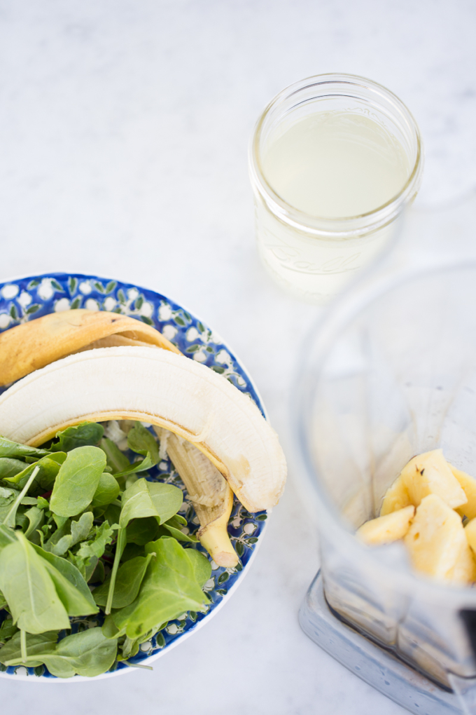 Pineapple, green leaves and banana ready to make the smoothie.