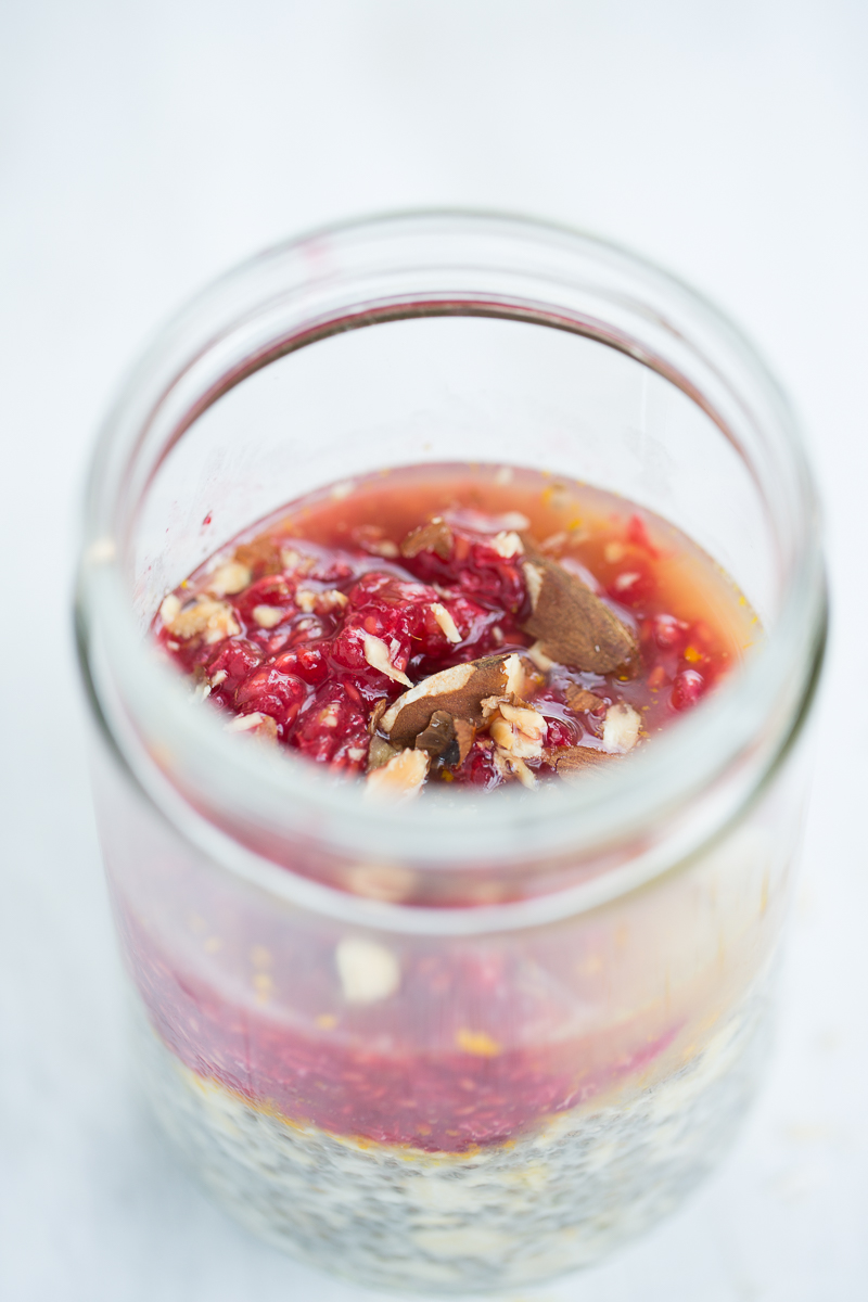 Oats and chia seed overnight delicious breakfast with almonds and raspberries