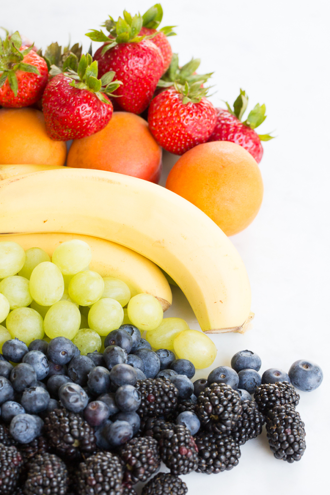 different Fruits ordered in rainbow colors