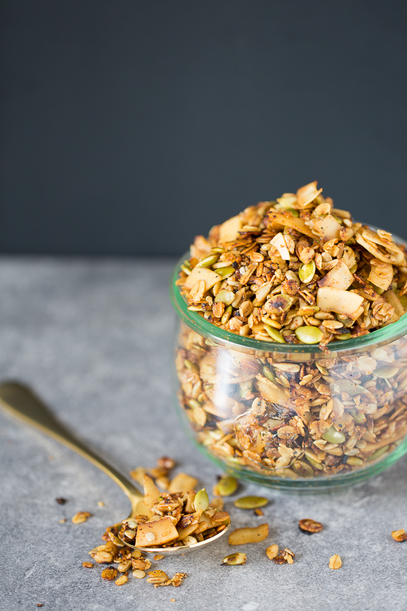 Savory and vegan granola in a glass container.