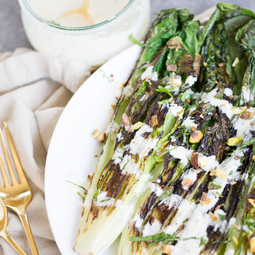 Roasted romaine lettuce with tahini dressing. Vegan grilled romaine salad.