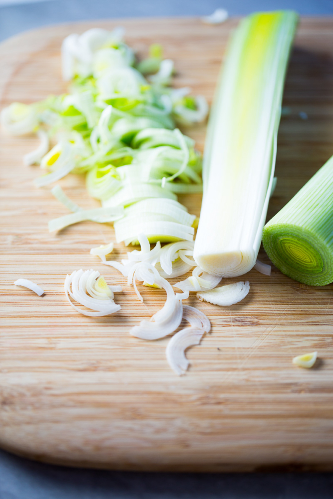 leeks over a cutting board
