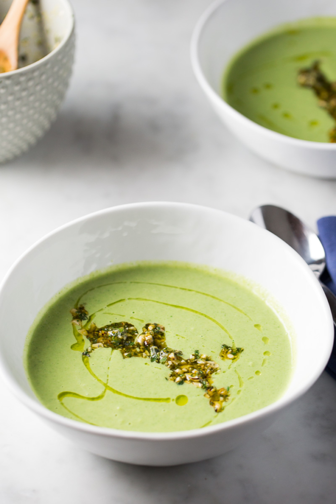 Vegan Broccoli soup with cashews topped with olive oil and chopped nuts
