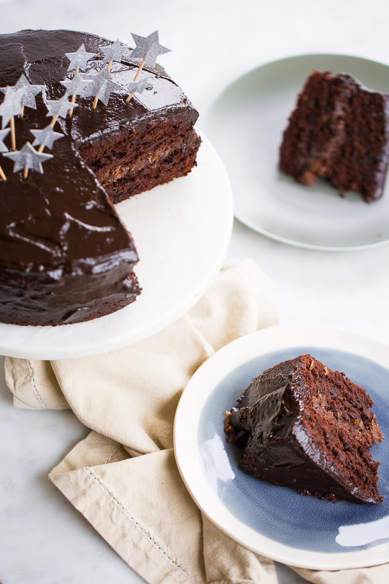 Vegan double chocolate birthday cake sliced and served.