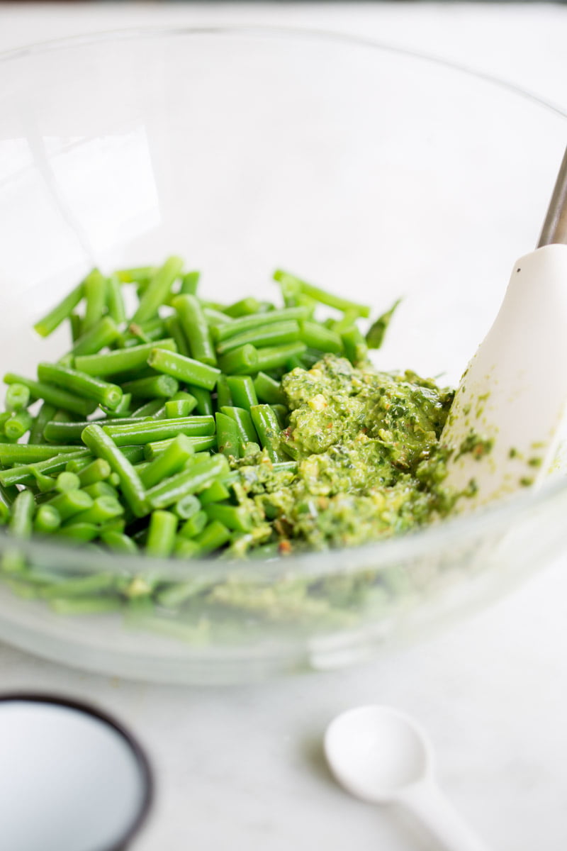 green beans and spicy almond pesto in a bowl