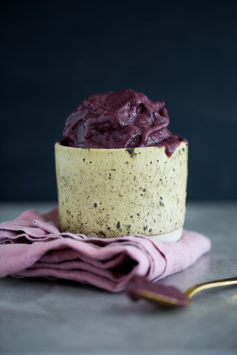 banana and acai ice cream served in a ceramic cup