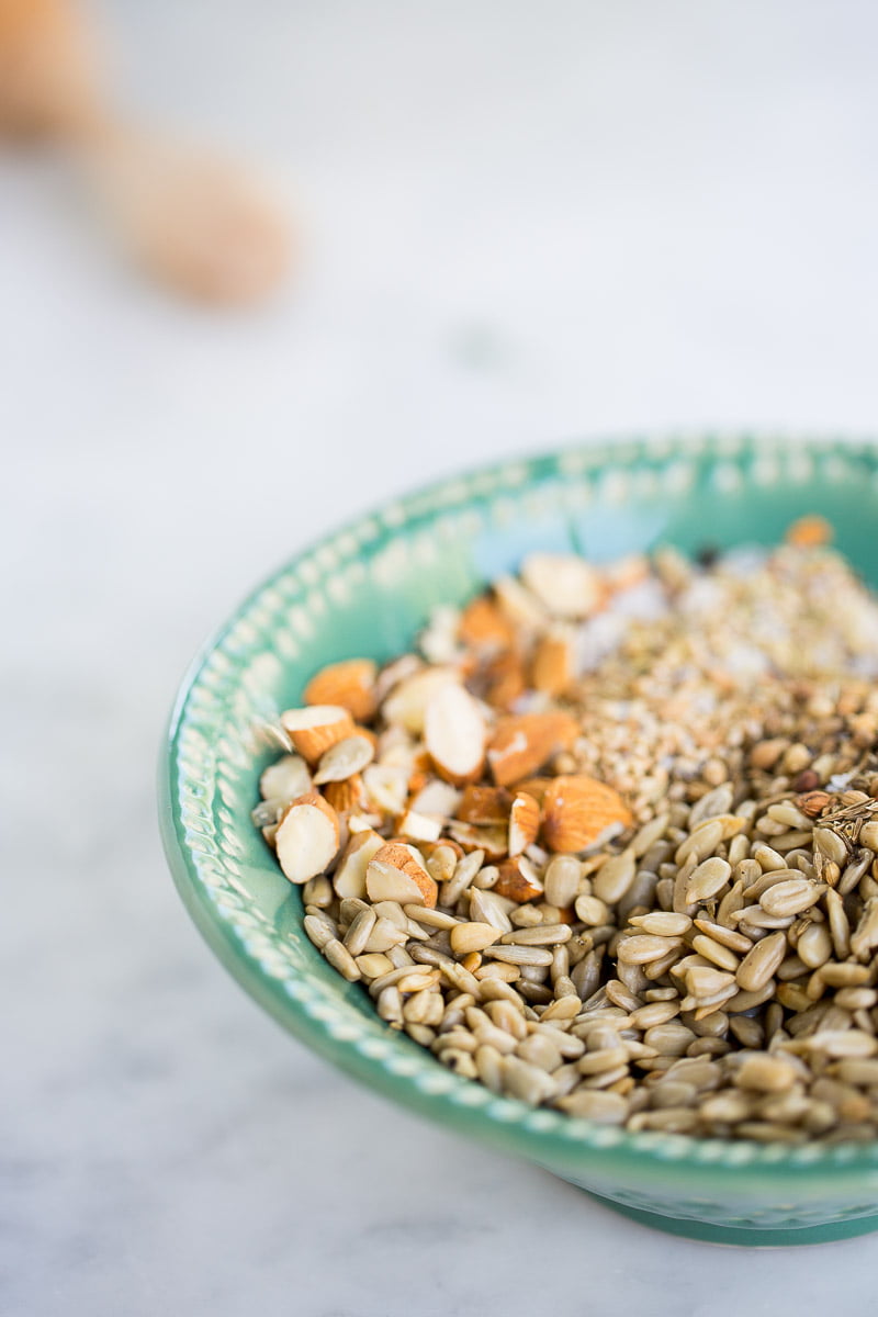 a hand made green bowl with dukkah