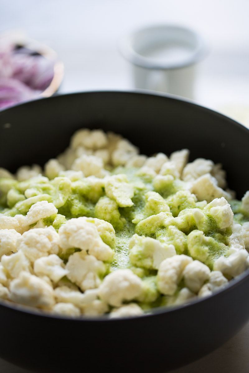 cauliflower florets marinating in salsa verde