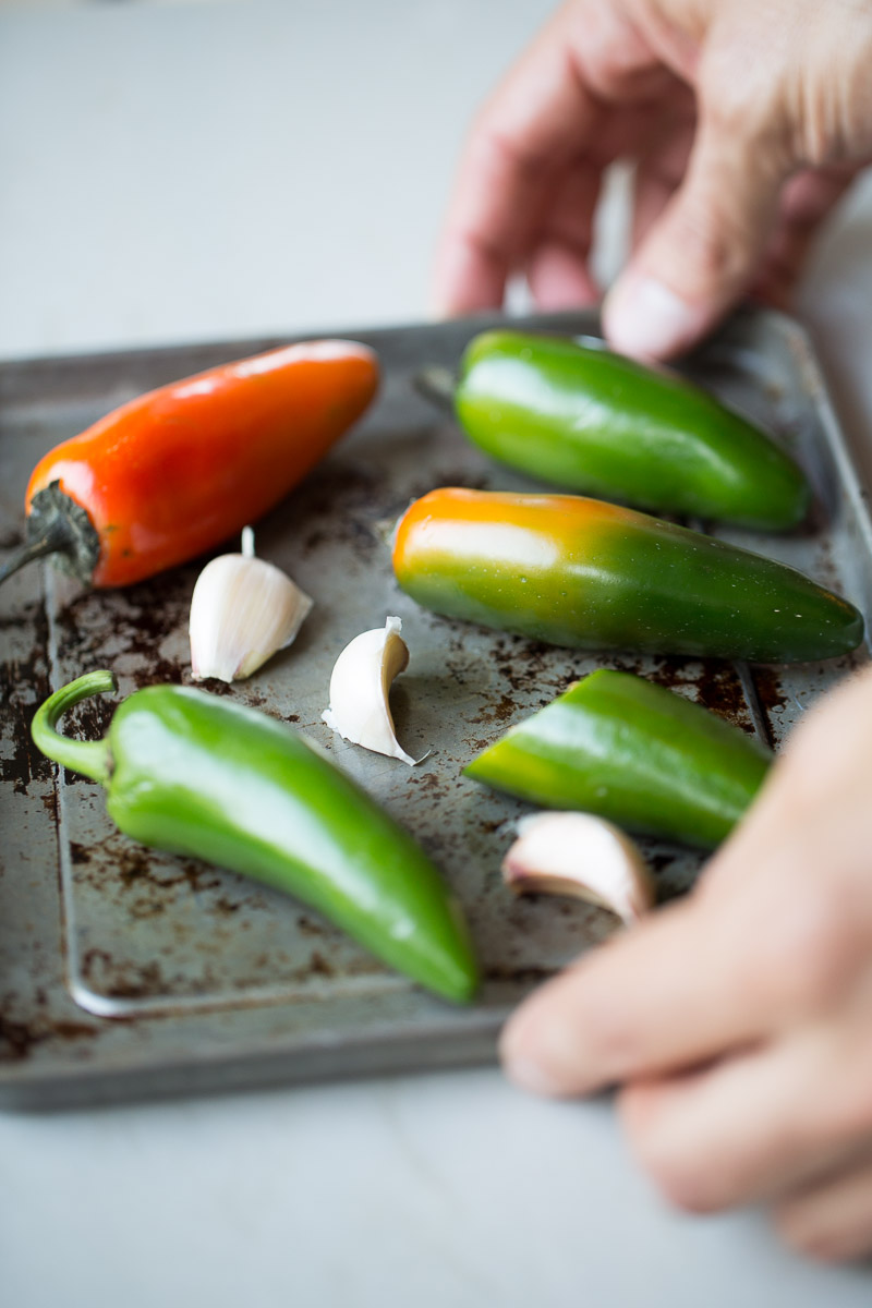 Quarter sheet pan with jalapeños and garlic cloves