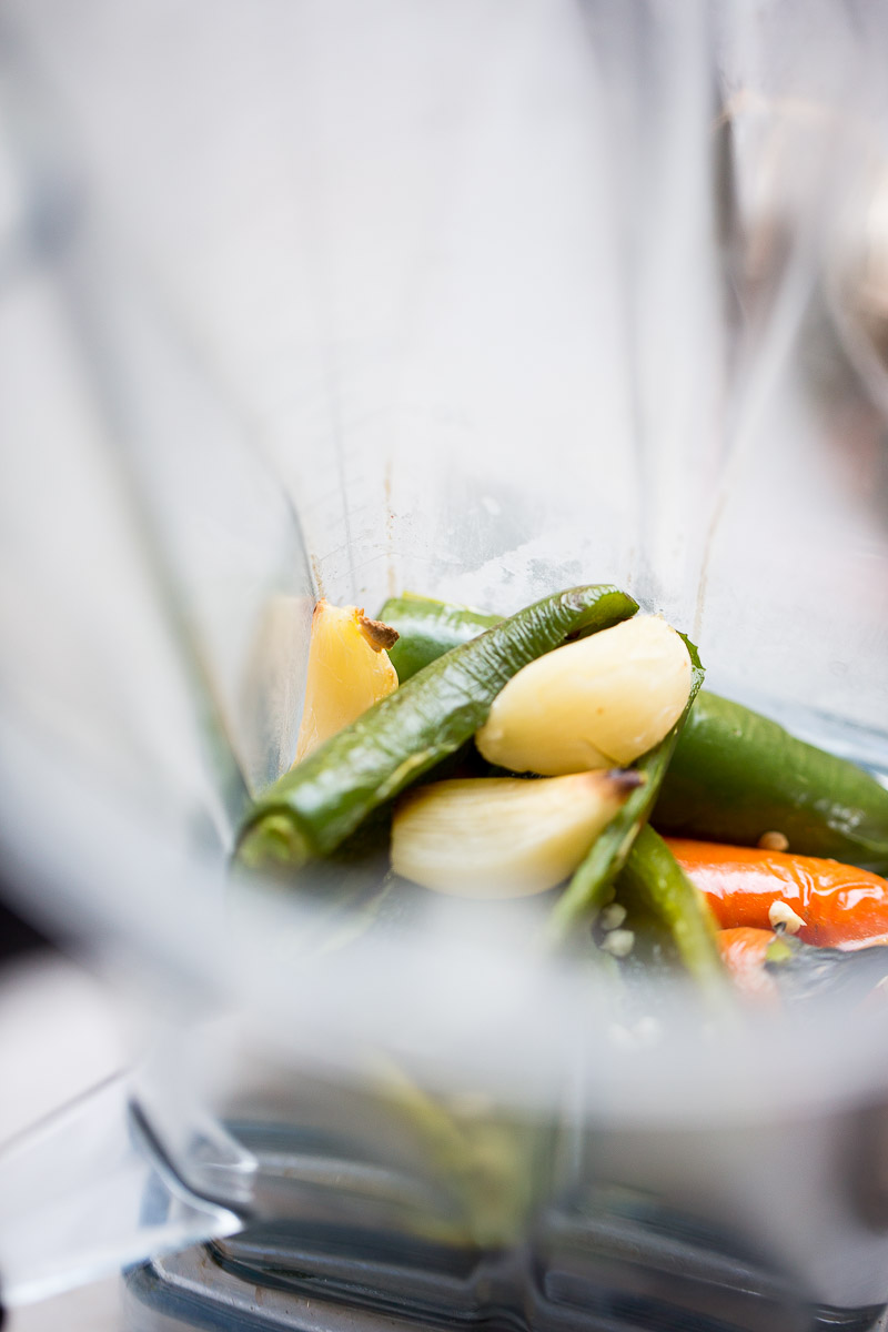 Roasted and halfved jalapeños in the blender with rpeeled and roasted garlic cloves