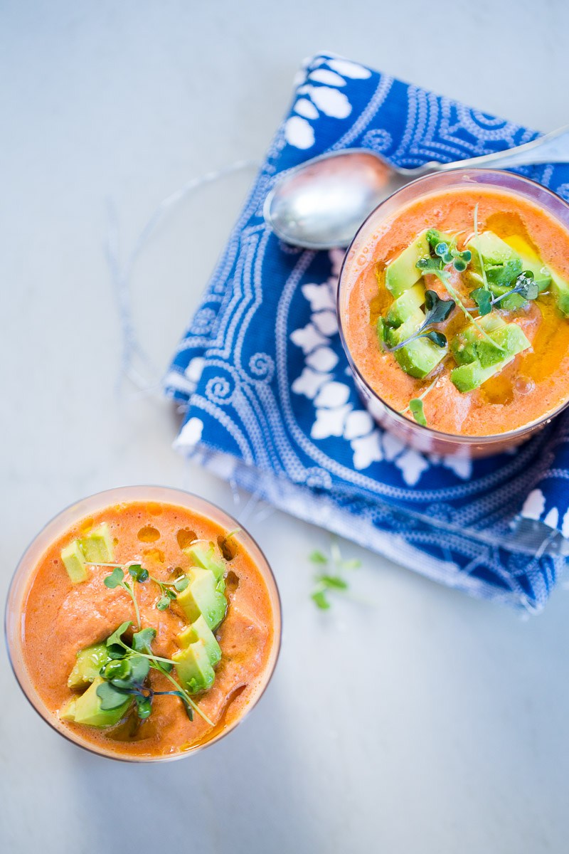 cold watermelon soup topped with diced avocado and micro greens