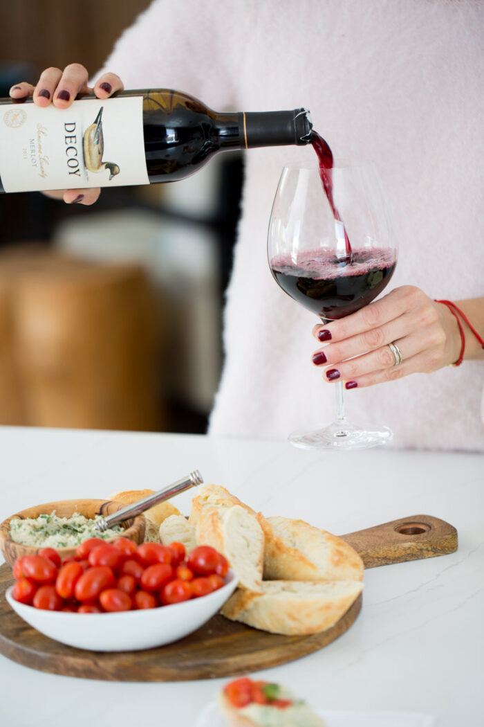 serving myself a glass of red wine