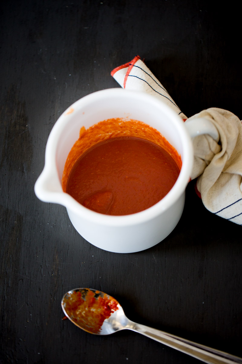 sriracha sauce in a white pot