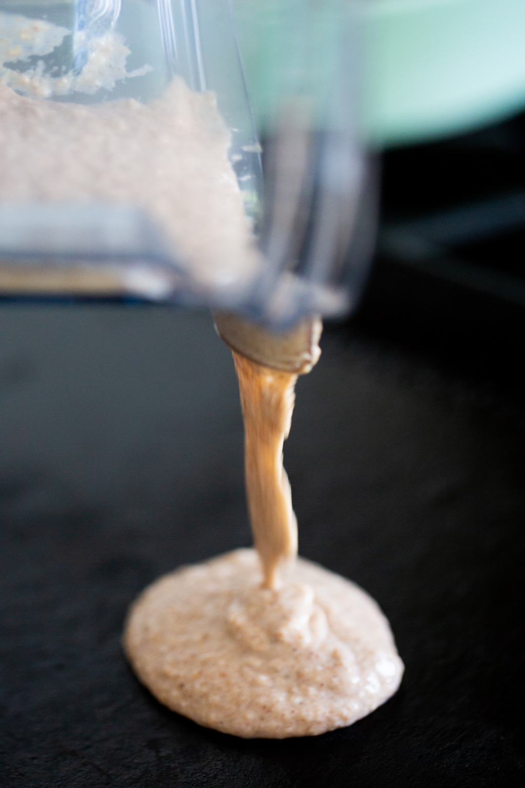 pouring oatmeal mix into pan to cook