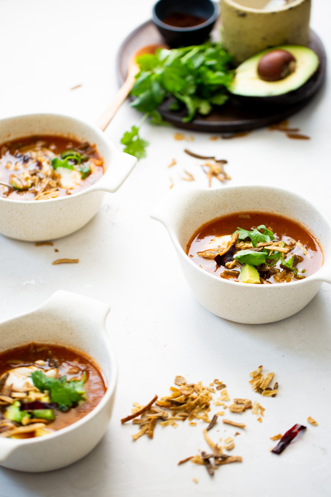 three bowls of vegan tortilla soup