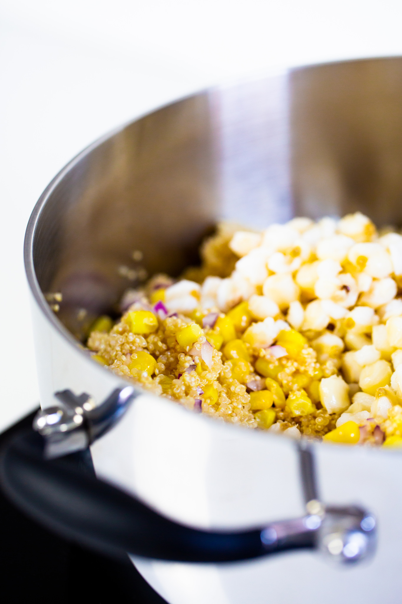 Quinoa with corn and corn on the cob in a pot