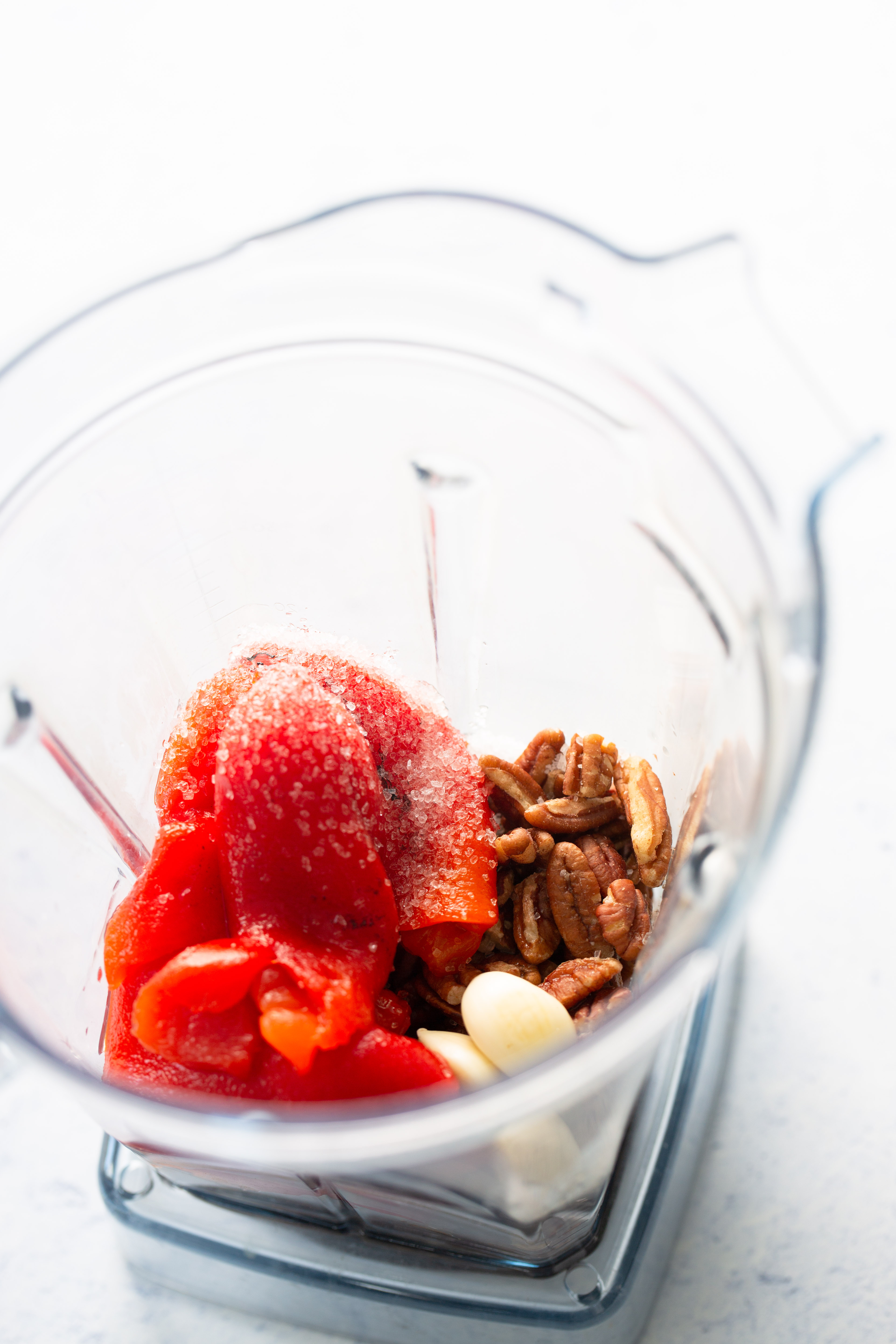 ingredients in the blender to make a red pepper creamy vegan sauce