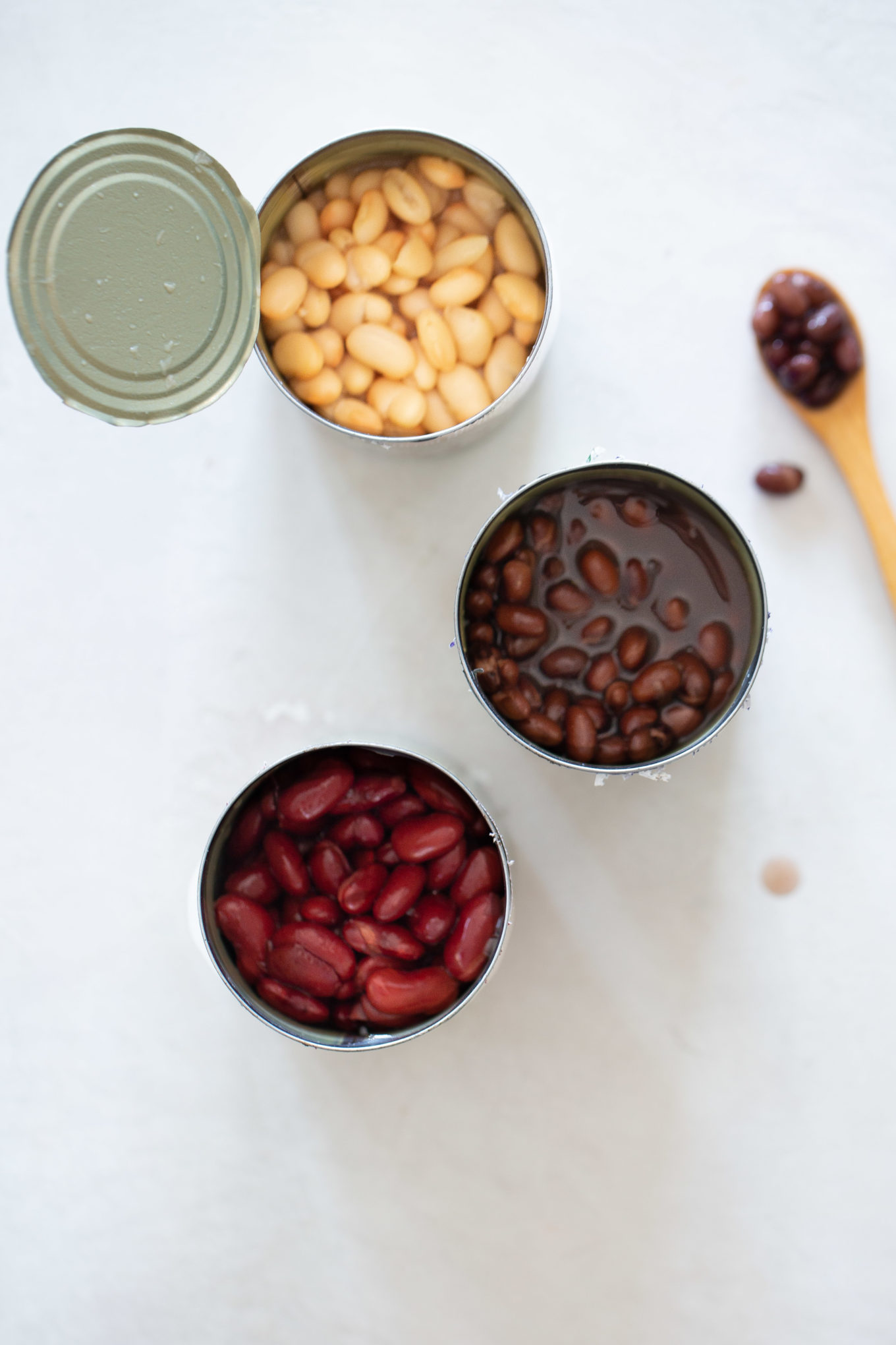 three cans of different beans