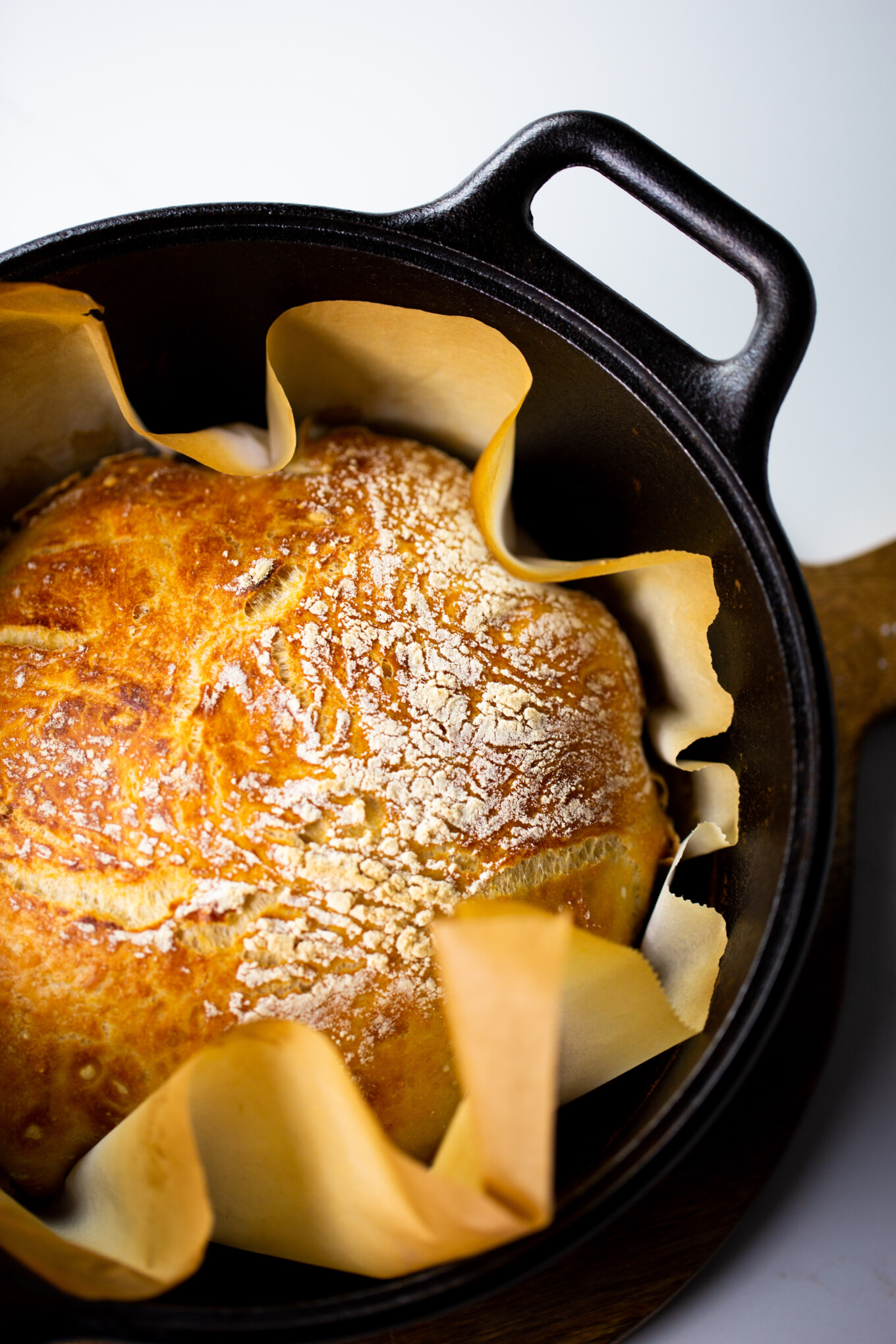 freshley baked crusty bread in a dutch oven.