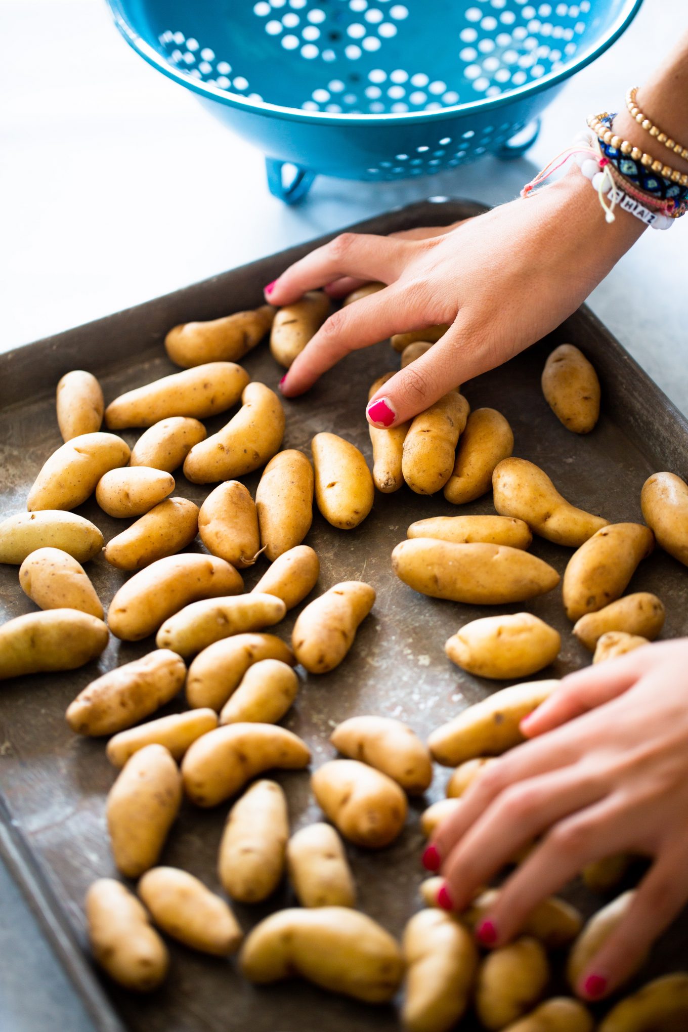 rubbing oil to fingerling potaotes