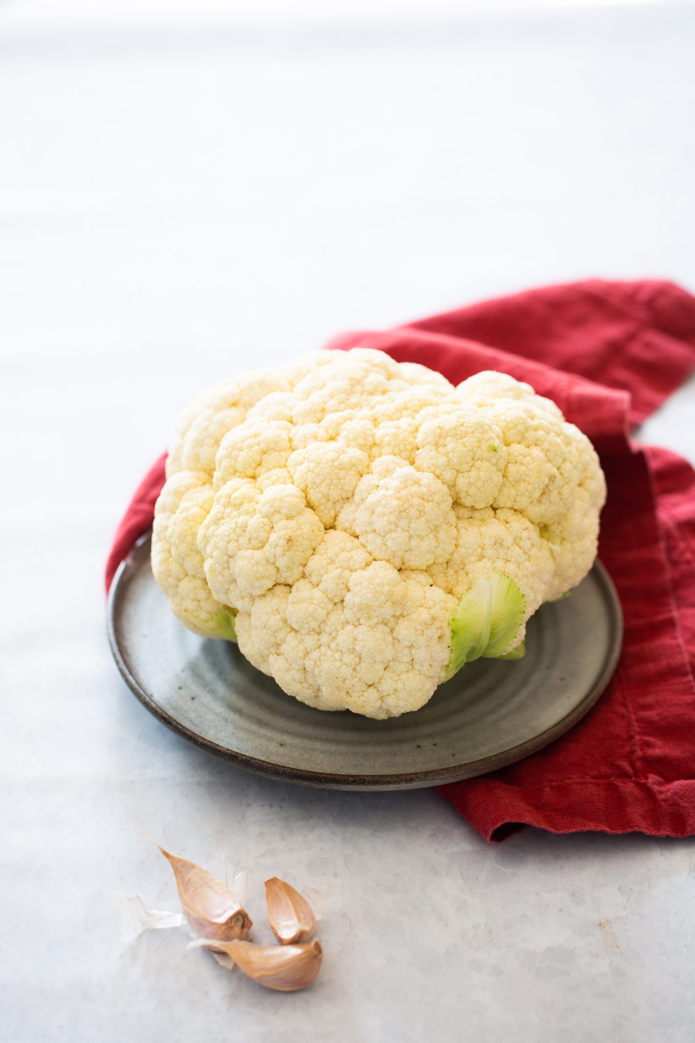 cauliflower head and garlic cloves to make garlic mashed cauliflower