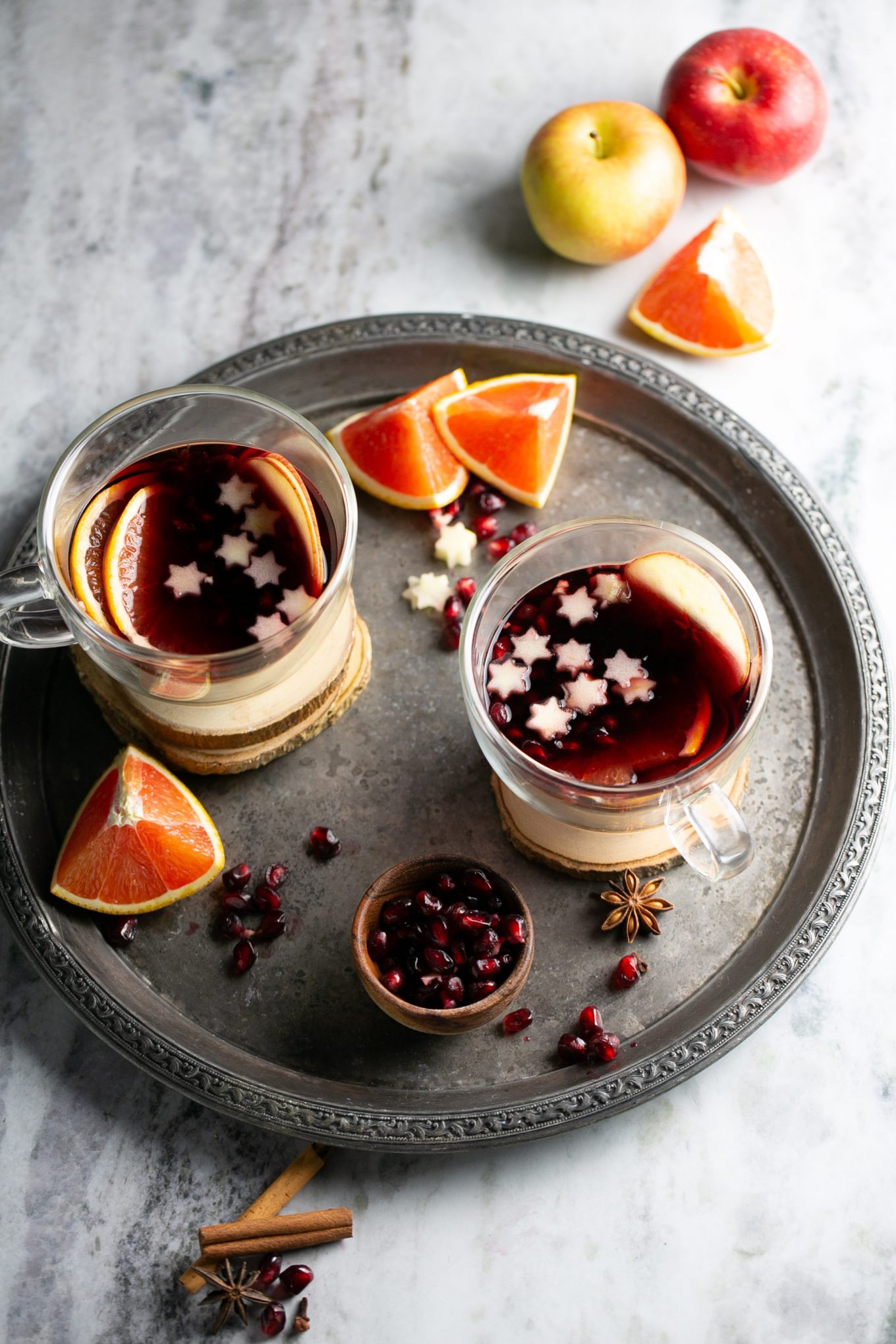 A festive drink made by simmering wine with warming spices like cinnamon and garnished with slices of oranges.