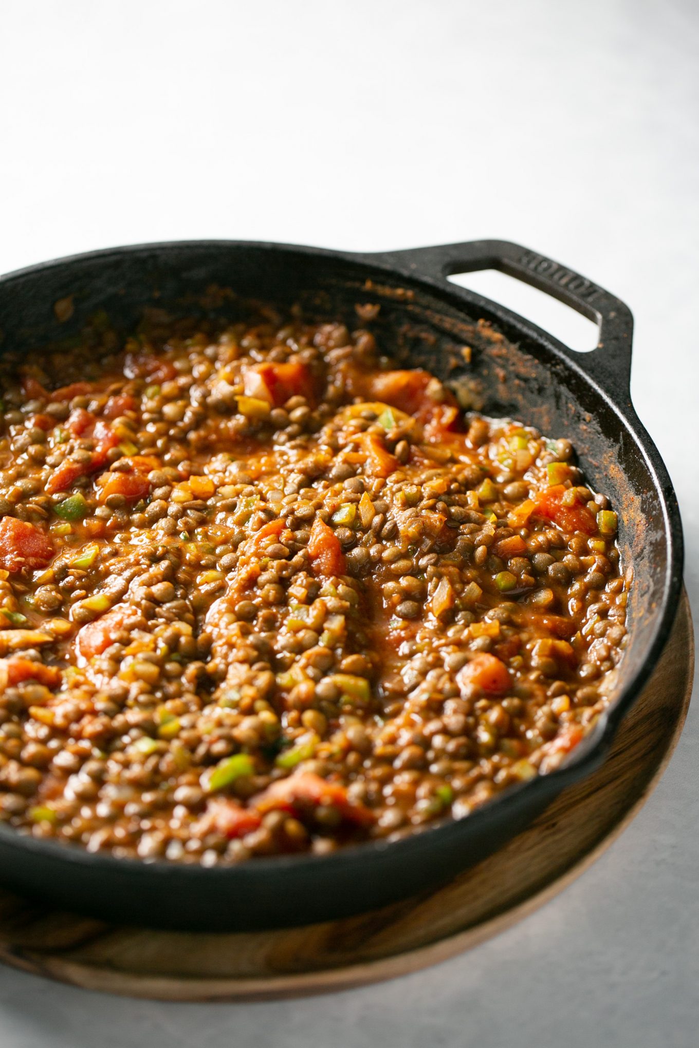 A Lentil Sloppy Joes (vegan sloppy joes) mixture in a irnon cast skillet.