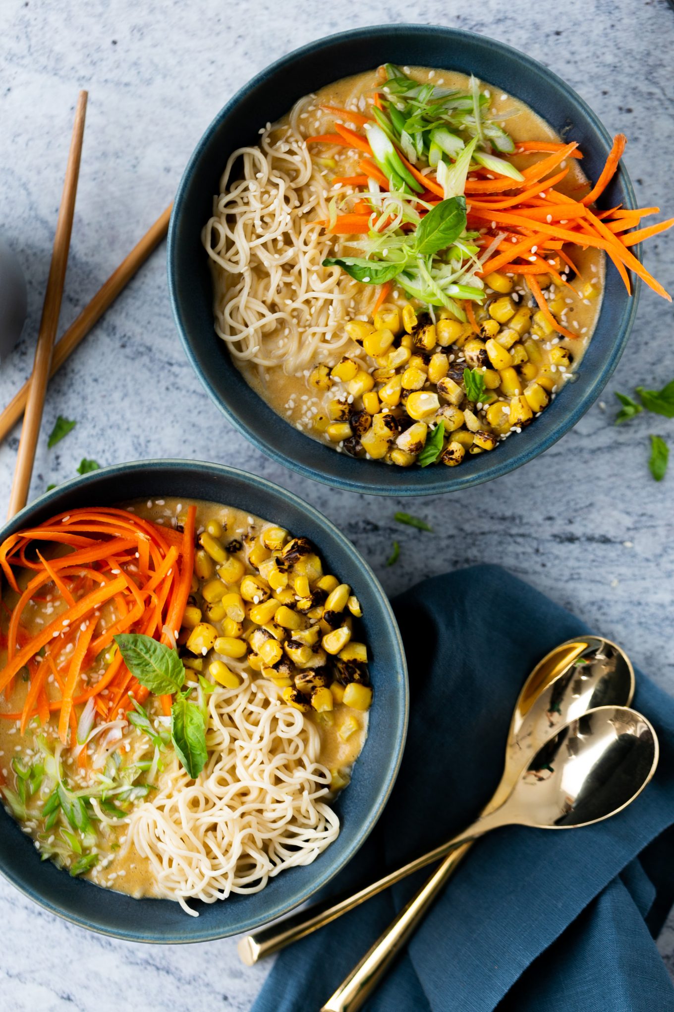 Two bowls of homemade creamy Ramen soup with noodles.