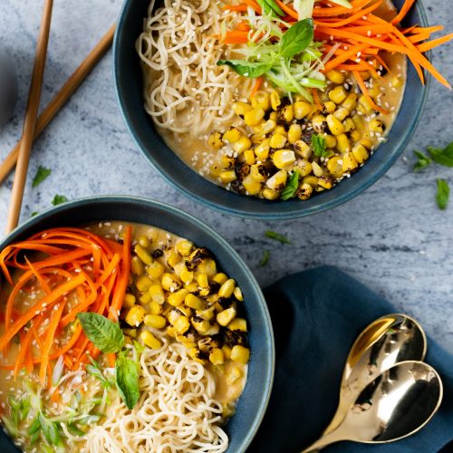 Two bowls of homemade creamy Ramen soup with noodles.