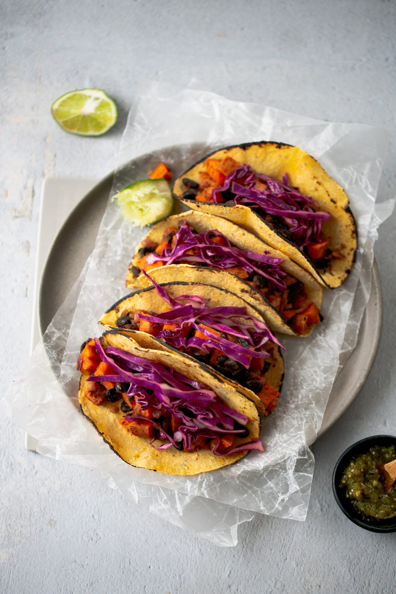 sweet potato and black beans tacos with red cabbage and salsa verde