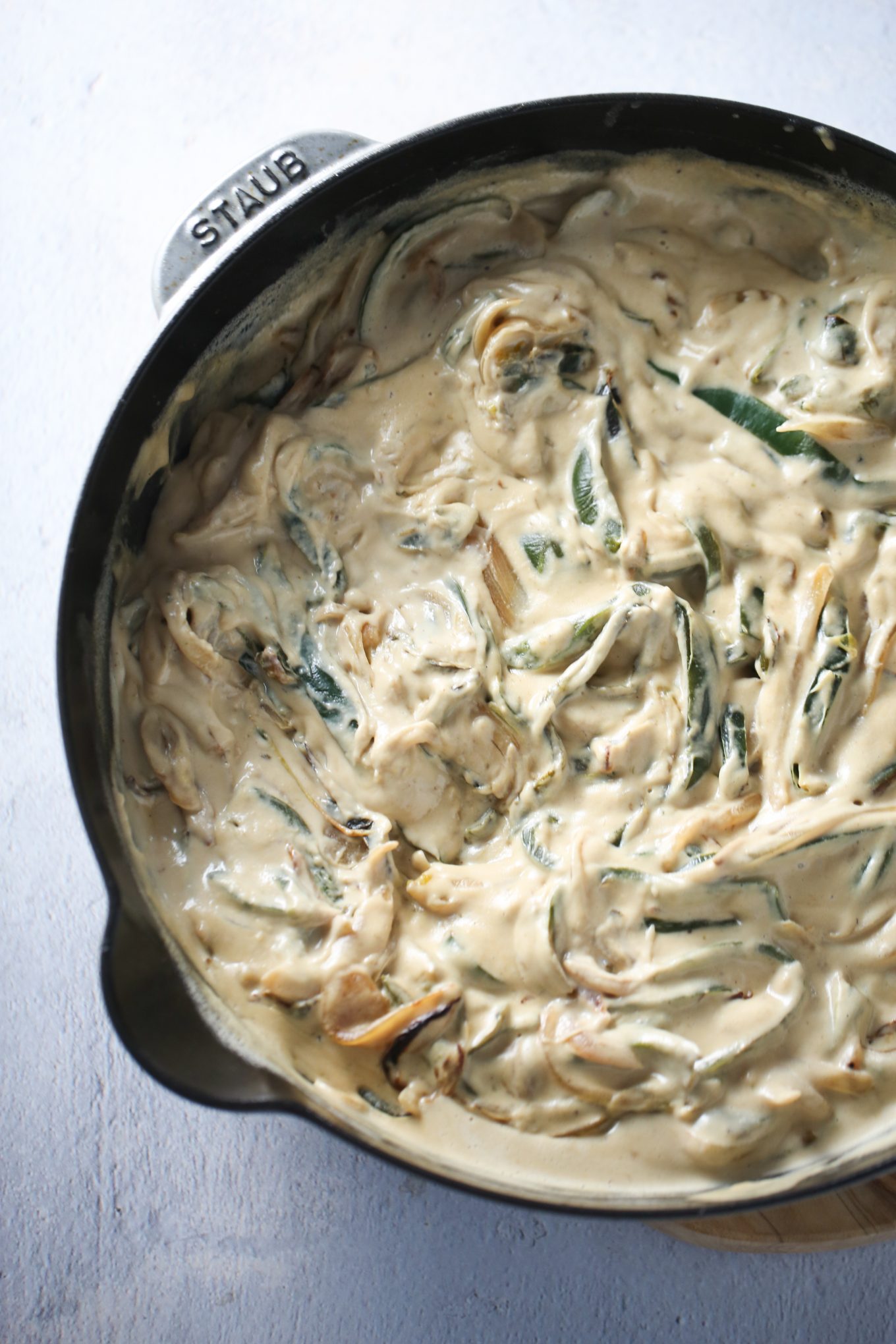 rajas con crema in a cast iron skillet