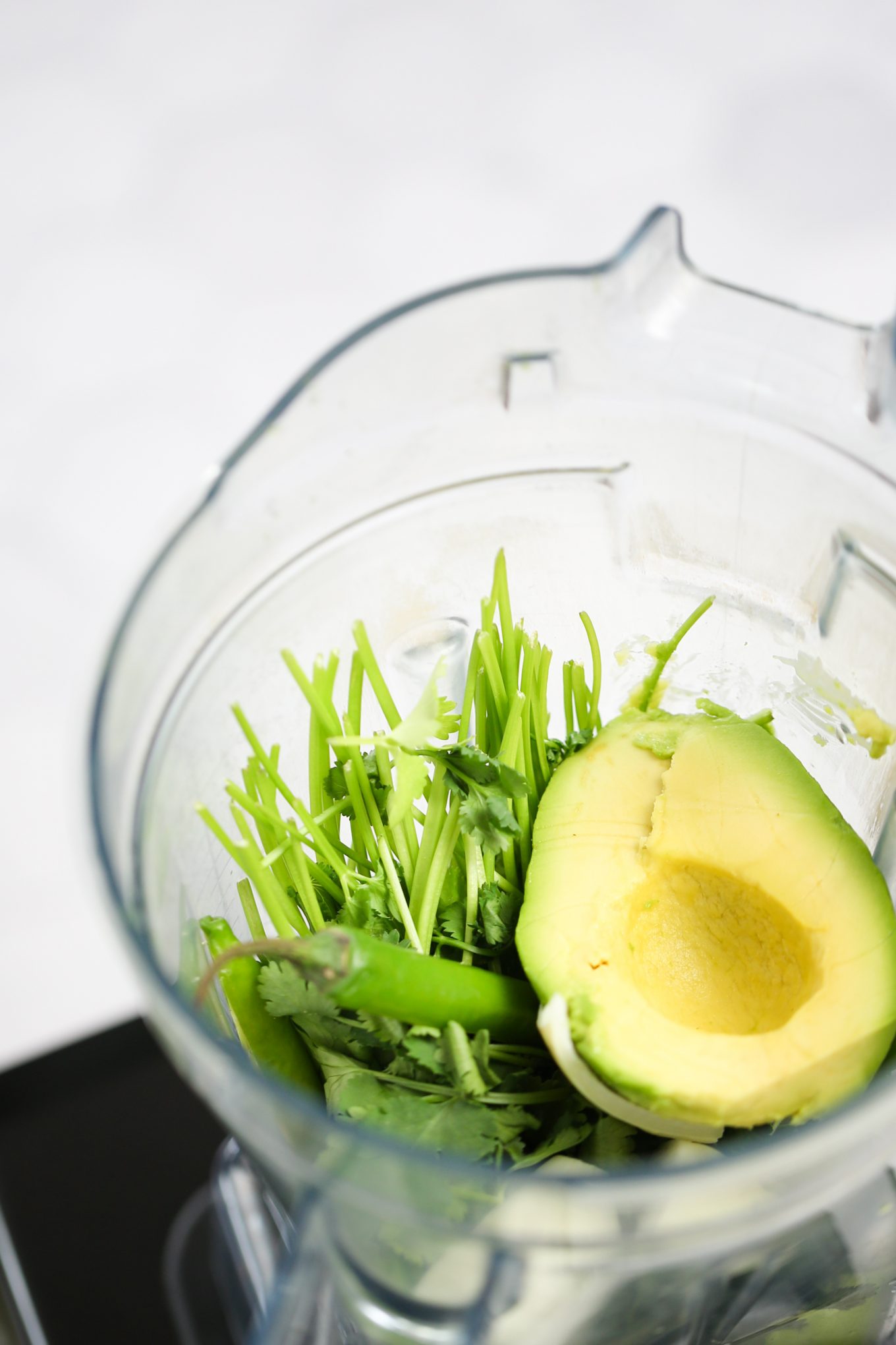 Ingredients to make salsa verde in the blender.