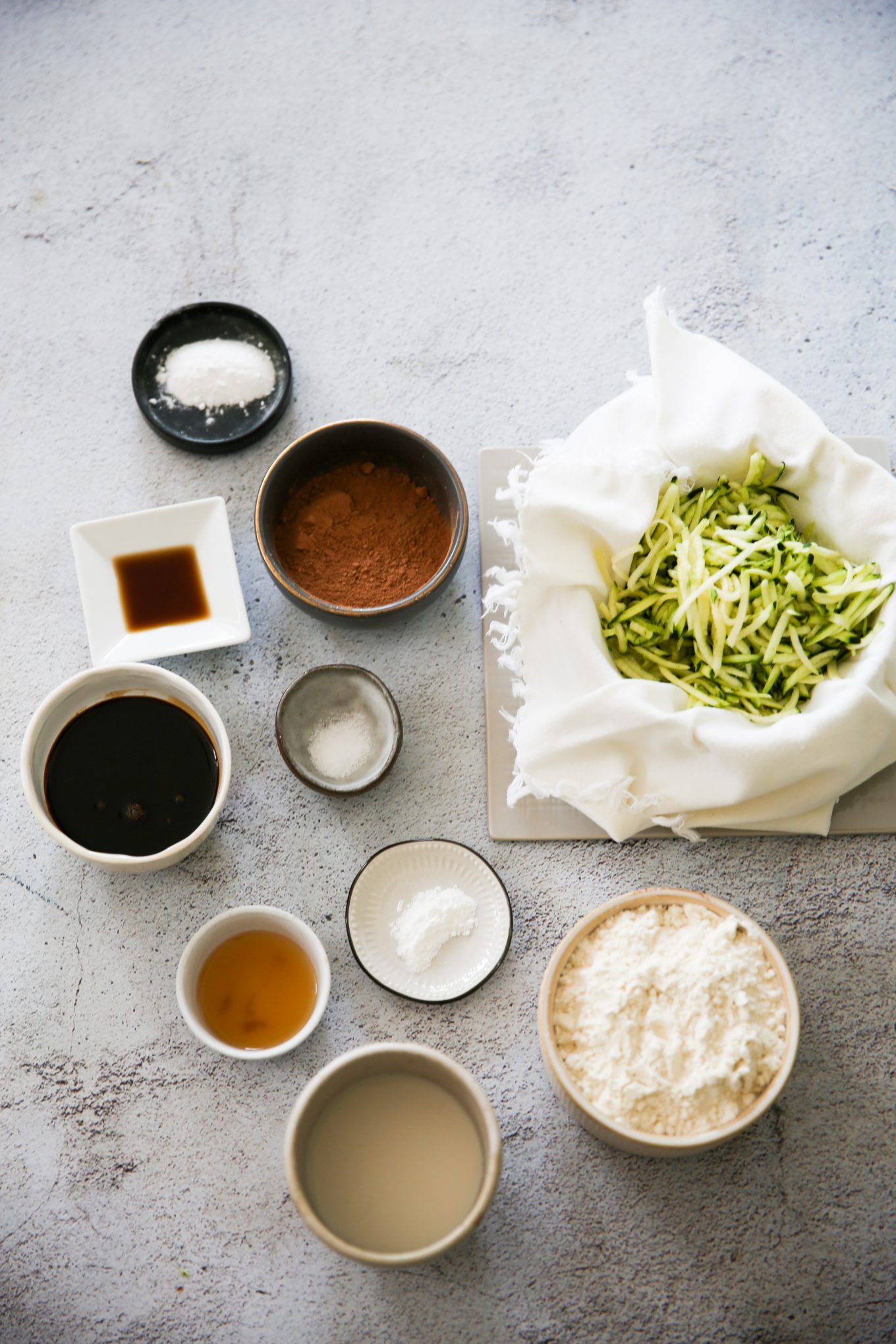 Ingredients for making vegan chocolate zucchini muffins