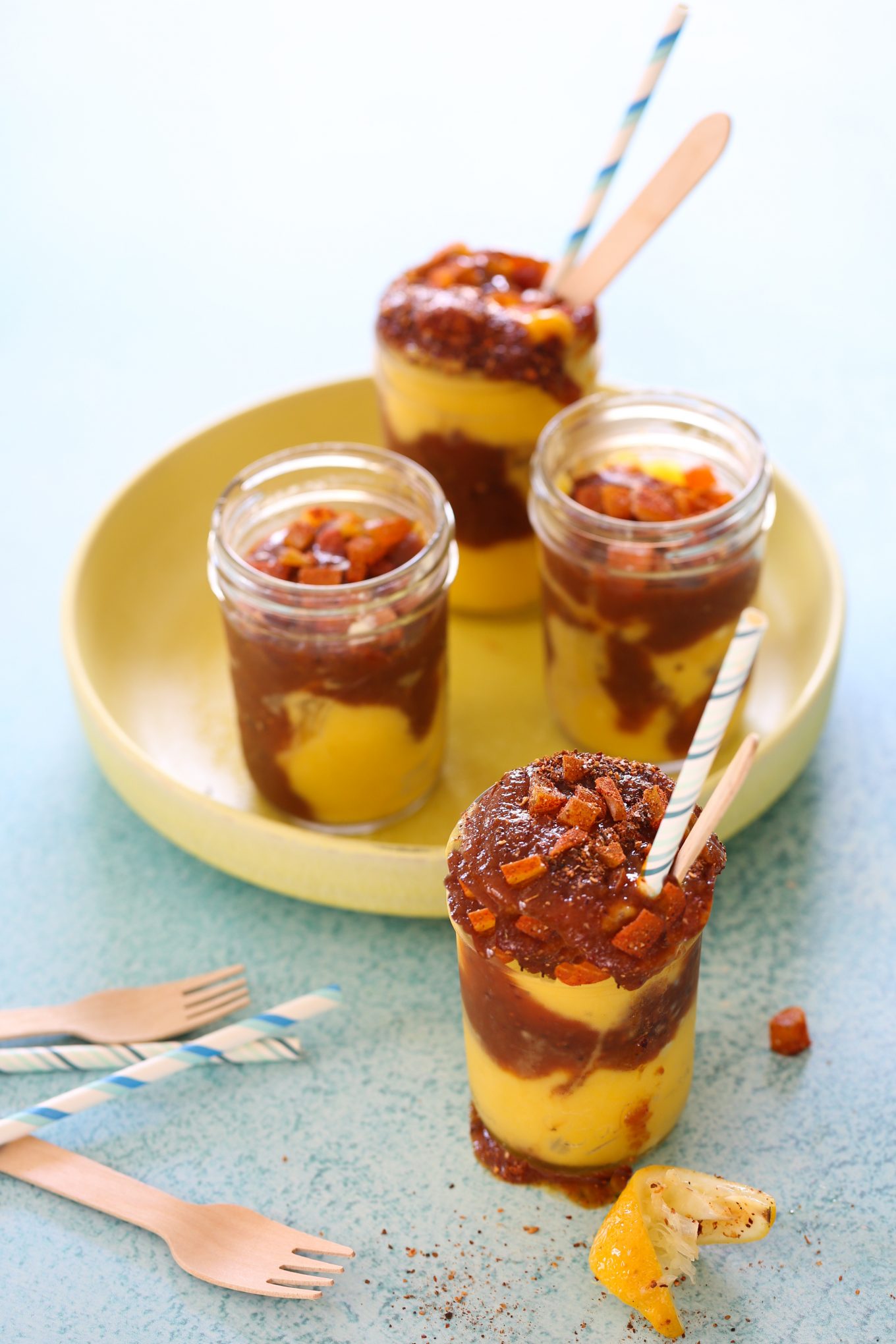 four mangonadas on a yellow dish