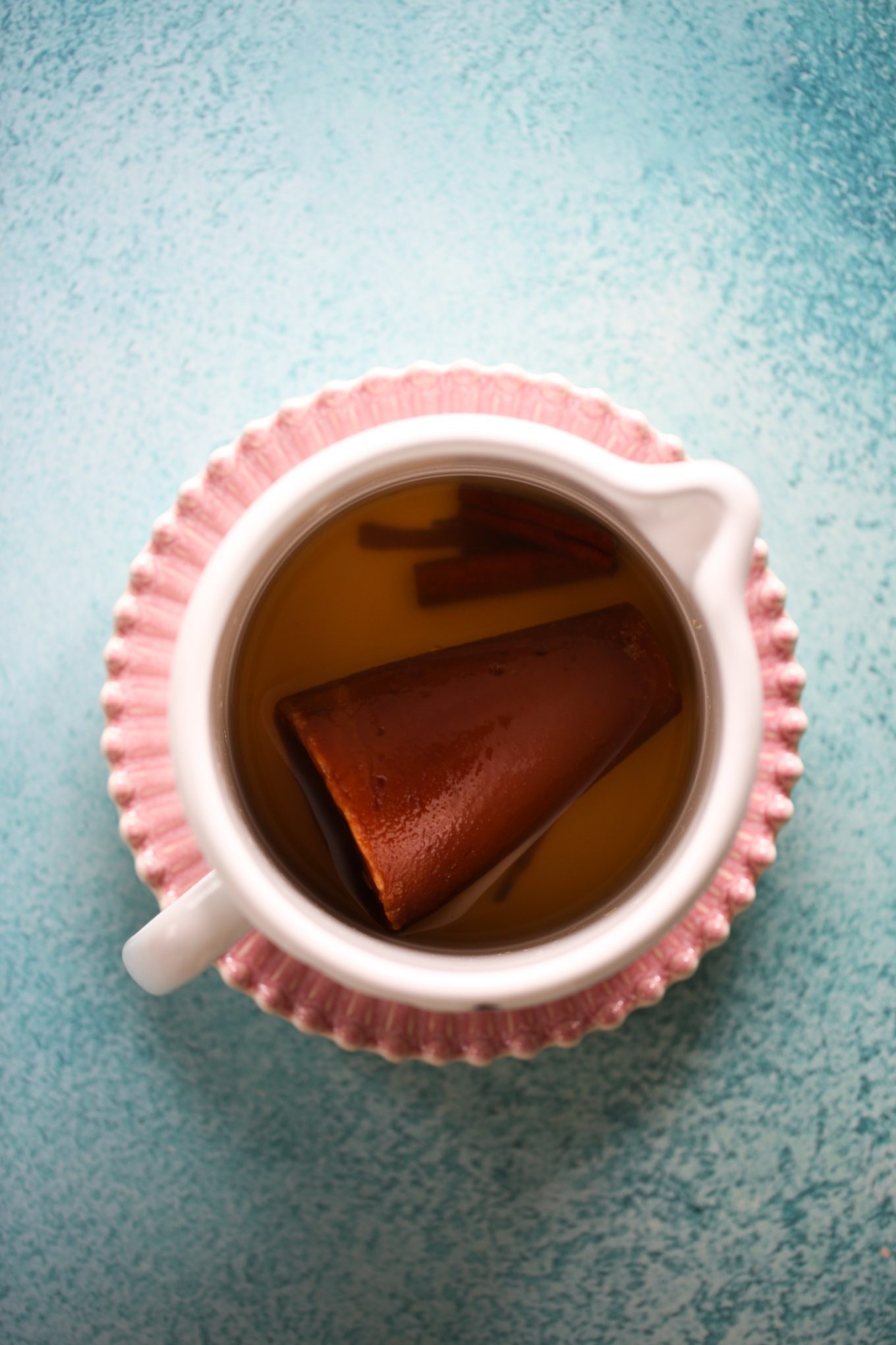 water, piloncillo cone and cinnamon in a saucepan with water