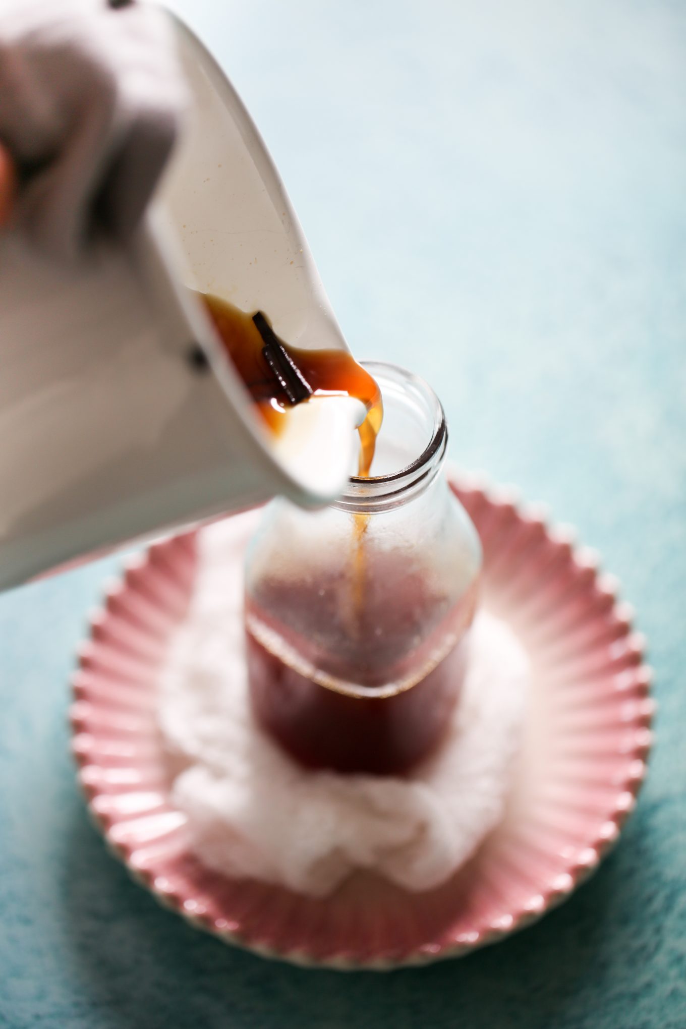 pouring the piloncillo syrup in the galss container