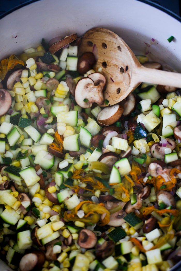 diced vegetables in a pot over medium heat