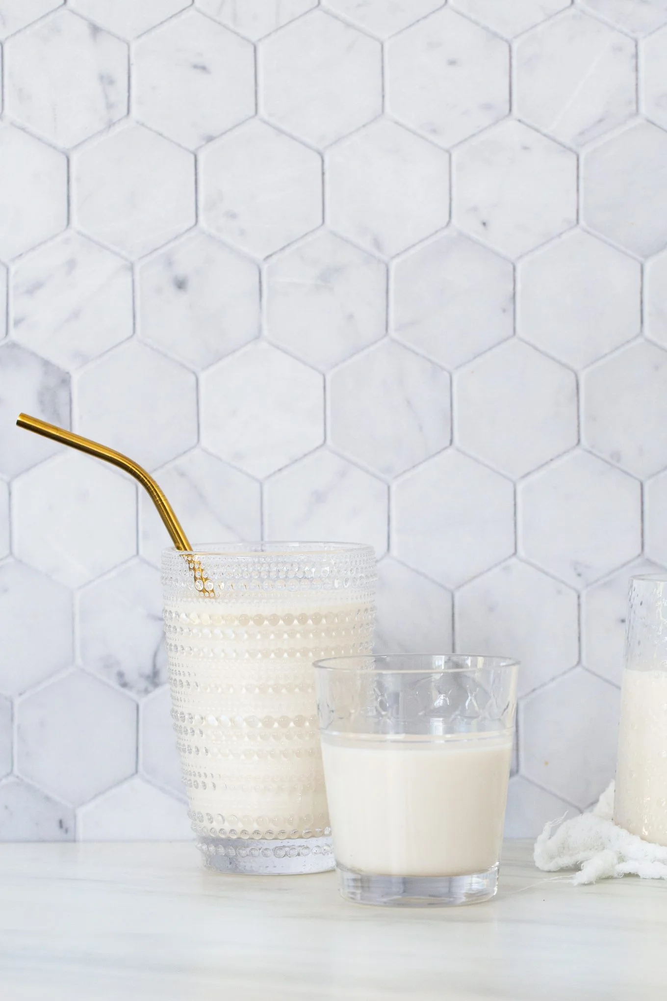 three glasses with almond milk